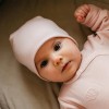 Розова бебешка шапка от мериносова вълна