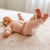 Розов растящ детски гащеризон от мериносова вълна