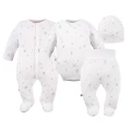 Baby set: bodysuit, footed pants, hat and white sleepsuit with leaf pattern